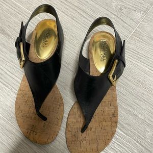 Michael Kors sandal has a small one and a half inch wedge size 6